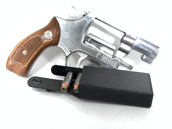 S&W Model 60 with 38 5 round Speed Strip carrier designed for carrying a spare speed strip . Made with carbon fiber reinforced nylon and features a patented locking system. ExtraCarry Front